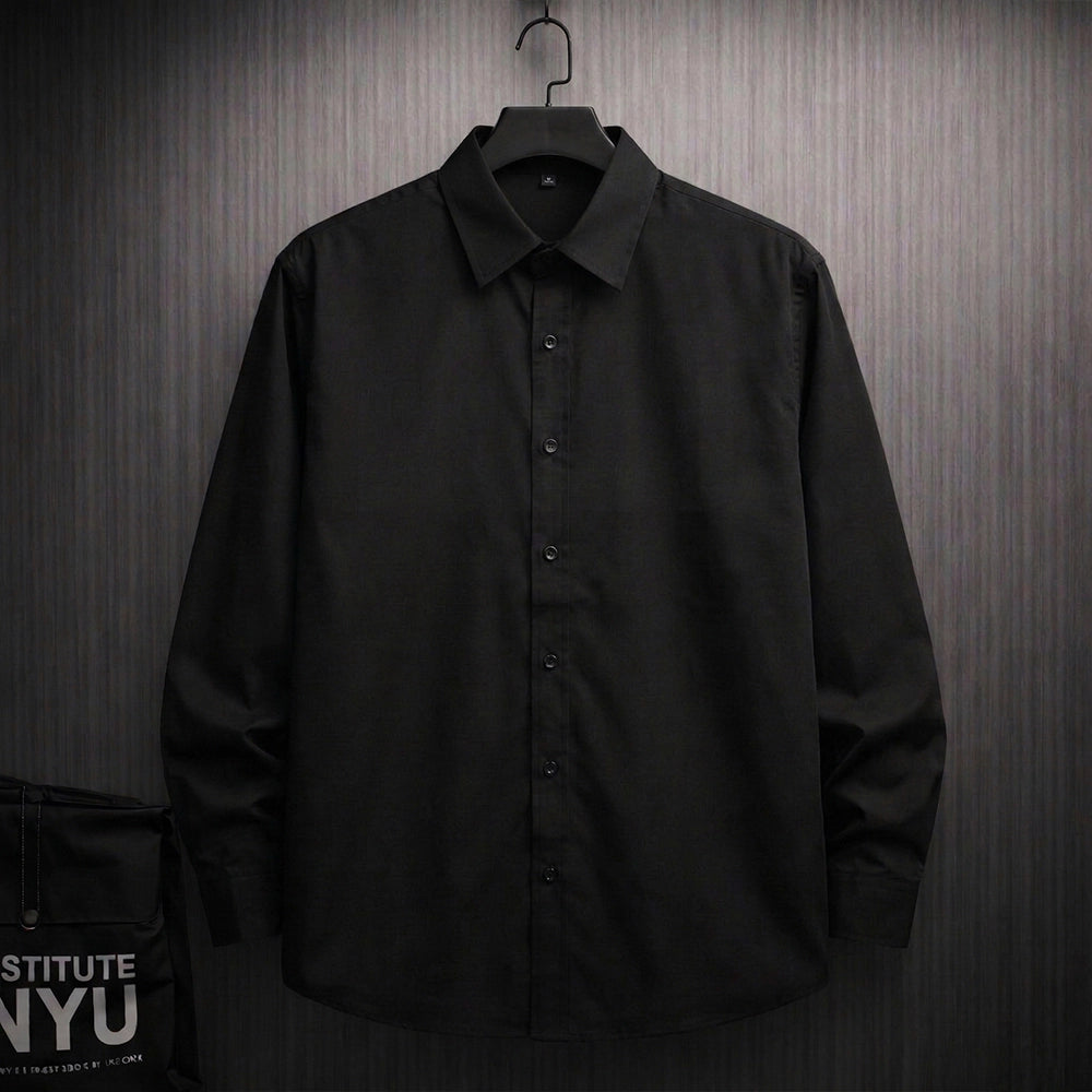 Black oversized shirt with Expression tree graphic made of faces on the back, artistic streetwear design for men.