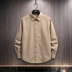 Beige oversized shirt with Expression tree graphic made of faces on the back, artistic streetwear design for men.