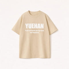 Men’s beige oversized t-shirt in cotton featuring a white YUEHAN graphic print for a casual streetwear look.