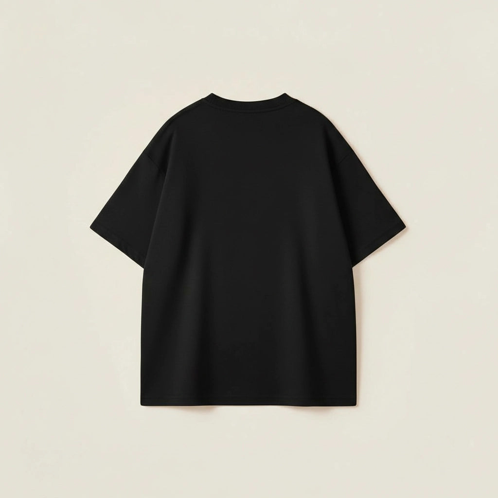 Men’s oversized black cotton t-shirt with drop shoulder fit and bold varsity typography design.