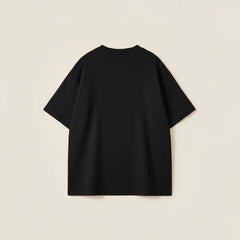 Black oversized crew neck tee for men featuring a raised white Porsche slogan in a loose fit.