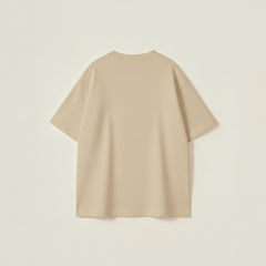Men’s beige oversized t-shirt with drop shoulder fit and bold collegiate athletic JUMP lettering.
