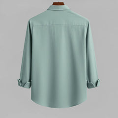 Men's seafoam green textured full sleeve shirt, back view, hanging on a wooden hanger against a light grey background, showcasing the fabric texture and relaxed fit.