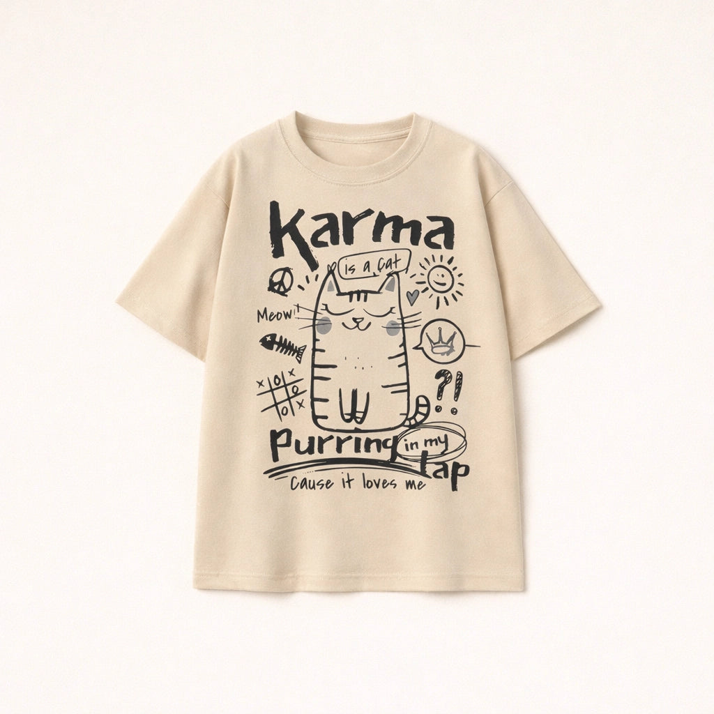 Oversized beige t-shirt for men with Karma is a cat purring in my lap hand-drawn doodle graphic.
