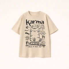 Oversized beige t-shirt for men with Karma is a cat purring in my lap hand-drawn doodle graphic.