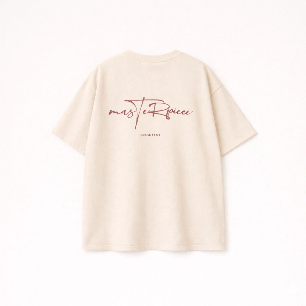 Men’s beige oversized cotton t-shirt with brown Masterpiece script graphic print on the back.