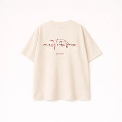 Men’s beige oversized cotton t-shirt with brown Masterpiece script graphic print on the back.