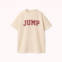 Oversized T-shirt for men in beige featuring a maroon JUMP varsity graphic print in streetwear style.