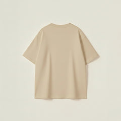 Beige oversized t-shirt for men with drop shoulder fit and bold varsity inspired graphic design.