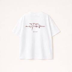 White t-shirt with red text on a light beige background