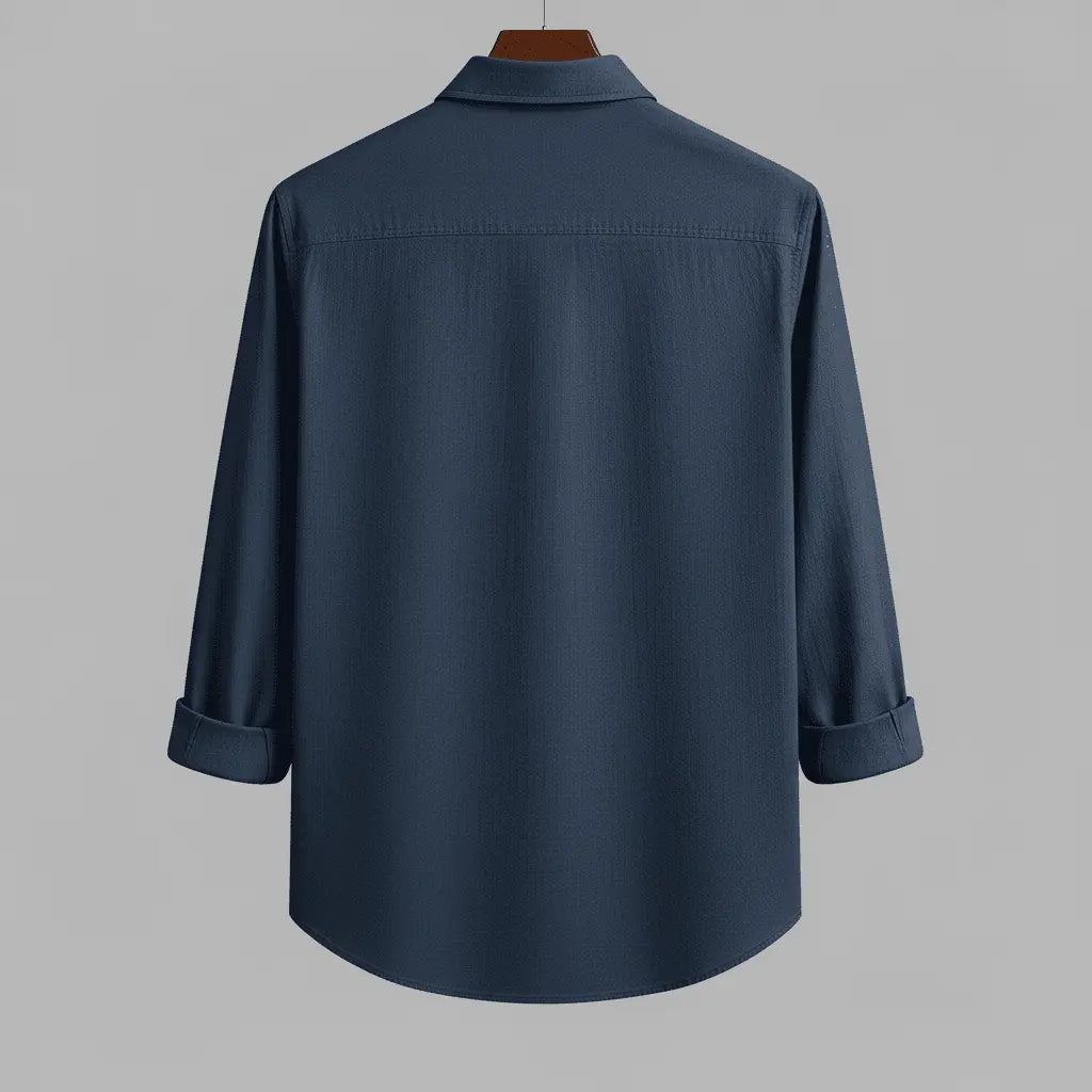 Men's deep navy textured full sleeve shirt, back view, hanging on a wooden hanger against a neutral grey background, showing the relaxed fit and textured fabric.