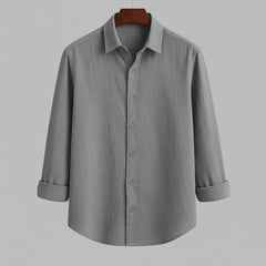 A grey long-sleeved men's casual shirt with a button-down collar, displayed from the front.