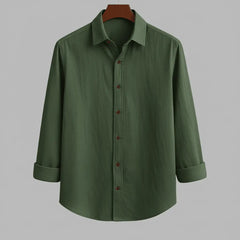Men's olive green textured full sleeve shirt, front view, displayed on a wooden hanger against a grey background, with sleeves rolled up.