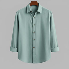 Men's seafoam green textured full sleeve shirt, front view, hanging on a wooden hanger against a light grey background.